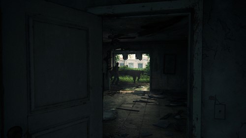 Joel beside a pool table in the ruins of an old apartment